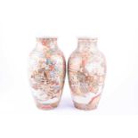 A pair of Japanese satsuma vases, late Meiji period, decorated with Samurai against a diapered
