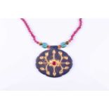 An Indian lapis and gemstone pendant necklace, the pendant of oval form, inset with flat-cut diamond