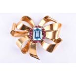 An impressive mid 20th century ribbon-twist brooch, the ornate yellow metal mount centred with an