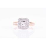 An 18ct yellow gold and diamond ringthe square-shaped mount of double cluster design, set with round