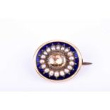 A 19th century yellow gold, citrine, pearl, and enamel broochcentred with a mixed oval-cut