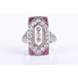 An Art Deco diamond and ruby tablet ring, centred with a panel of white rock crystal mounted with