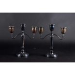 A boxed pair of Mappin & Webb two-branch candlesticks, Birmingham 1954, with tapering columns on a