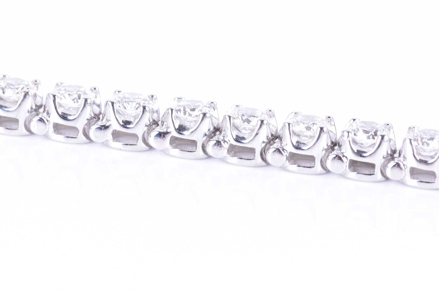 A fine quality 14ct white gold and diamond line bracelet, set with thirty round brilliant-cut - Image 4 of 9