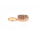 A yellow metal gents gold ring, with stepped decoration, indistinct marks to shank, size S, together