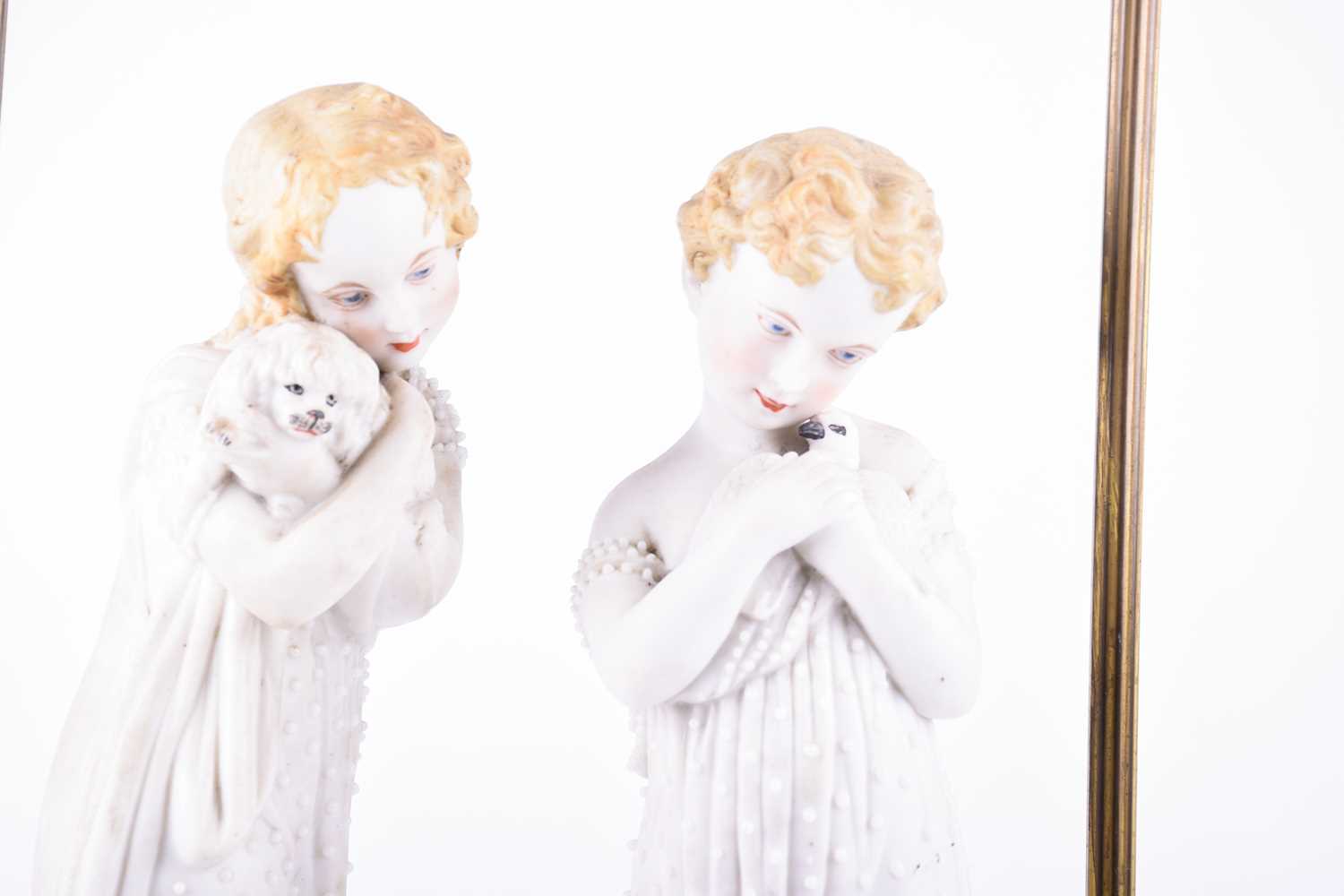 A group of Continental porcelain and bisque figures, late 19th century, to include a pair of young - Image 7 of 7
