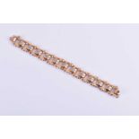A 1950s/60s 14ct yellow gold and diamond braceletformed of articulated links, joined by segments