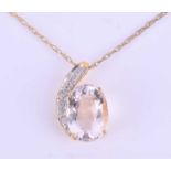 An 18ct yellow gold, diamond, and kunzite pendantset with a mixed oval-cut pale pink kunzite, with a