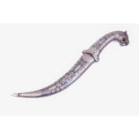 A large persian dagger, with niello style decoration, the pommel formed as a tigers head, the curved