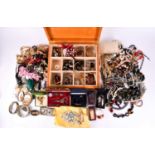 A large box of costume jewellery to include various beaded necklaces, bracelets, rings, brooches