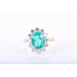 An impressive 18ct yellow gold, diamond, and emerald ring, set with a mixed oval-cut emerald of 3.71