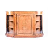 A Victorian mahogany and inlaid credenza, with brass mounts and two curved glass panel doors