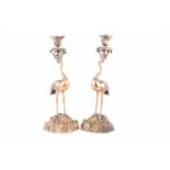 A pair of 19th Century gilt bronze candlesticks, after a design by Thomas Abbott, modelled in the