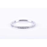 A platinum and diamond ring pave-set with round brilliant-cut diamonds, width 1.1 mm, size M 1/2,