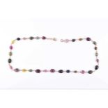 A 14ct yellow gold and varicoloured tourmaline necklacecomprised of briollete-cut pear, oval, and