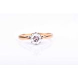 An 18ct yellow gold and solitaire diamond ring, set with a round brilliant-cut diamond of