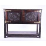 A 19th century oak side cabinet / court cupboard, probably formerly a dresser base, with carved