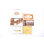 A collection of assorted cigars, including an unopened box of Quintero y Hno Cienfuegos cigars,