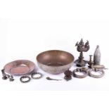 A Tibetan cast bronze oil lamp, hentha weights, a leaf shape oil lamp, an Indian brass bowl, a