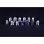 A collection of assorted thimbles, to include an enamel example decorated with a small dog, silver
