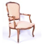 A Continental fruitwood Fauteuil armchair, with carved frame, open arms and upholstered back, seat