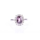 A 14ct white gold, diamond, and purple spinel ringset with a rectangular cushion-cut purple spinel
