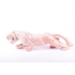 A large pink hardstone model of a panther n the Art Deco style, 58 cm x 19 cm.Condition report: Some