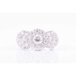 An 18ct white gold and diamond triple cluster ringset with three larger round brilliant-cut diamonds