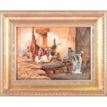 19th Century Orientalist school, 'An Arabian carpet weaver's workshop', an interior scene with