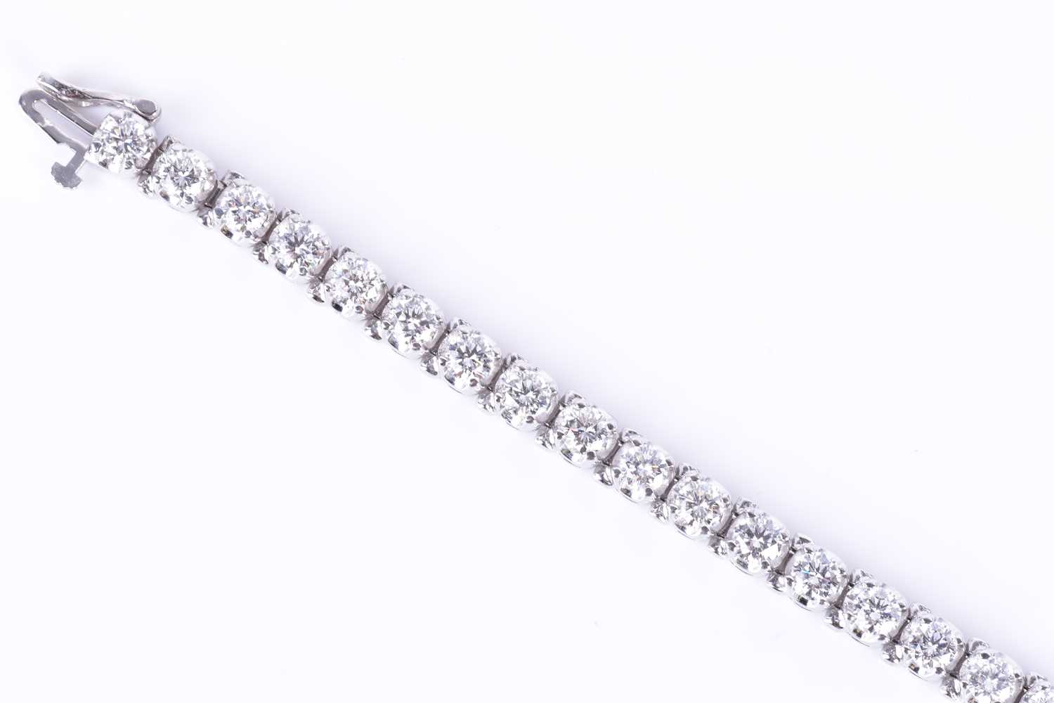 A fine quality 14ct white gold and diamond line bracelet, set with thirty round brilliant-cut - Image 3 of 9