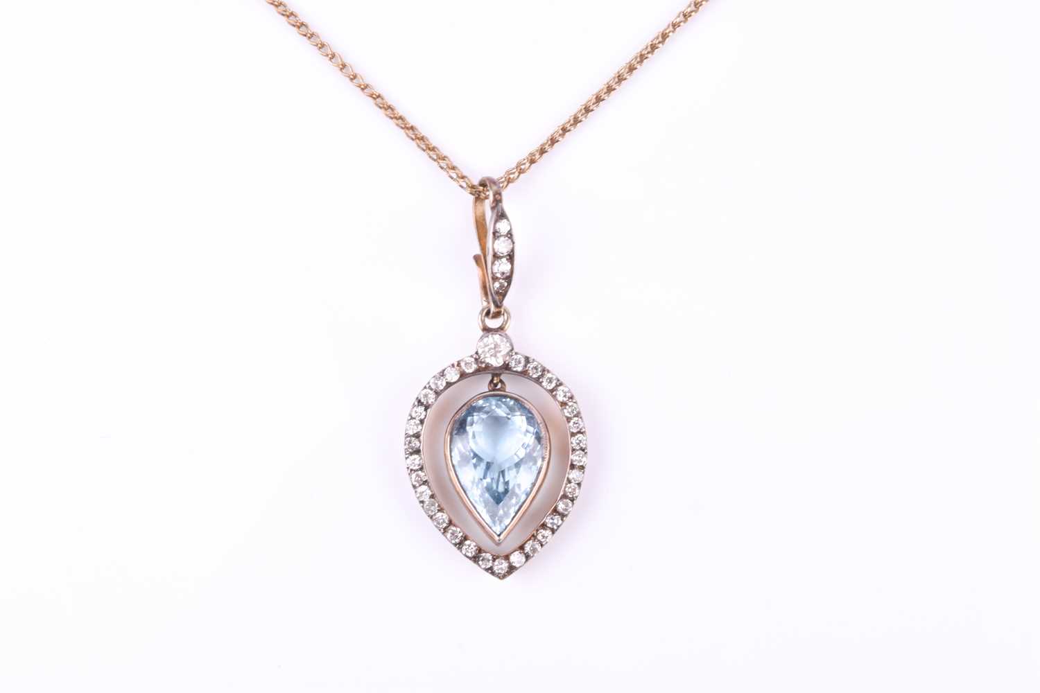 A late 19th / early 20th century diamond and aquamarine pendant, the tapered frame mount inset