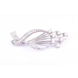 An 18ct white gold and diamond spray brooch, set with seven round brilliant-cut diamonds of