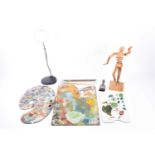 A group of three mid 20th century well-used artist's palettes with remnants of original oil paint,