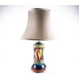 A Moorcroft 'Leaf & Berry' pattern table lamp, third quarter 20th century, the stepped top above a