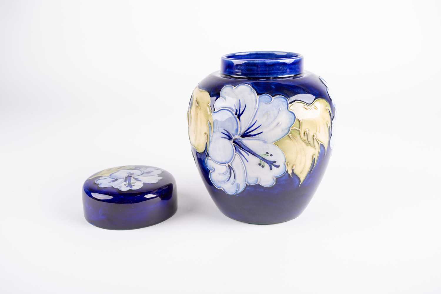 A Moorcroft Hibiscus pattern ginger jar and cover, the pale blue flowers against a dark blue ground, - Image 3 of 4