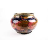 A William Moorcroft 'Pomegranate' pattern jardiniere, dated 1913, decorated with a band of