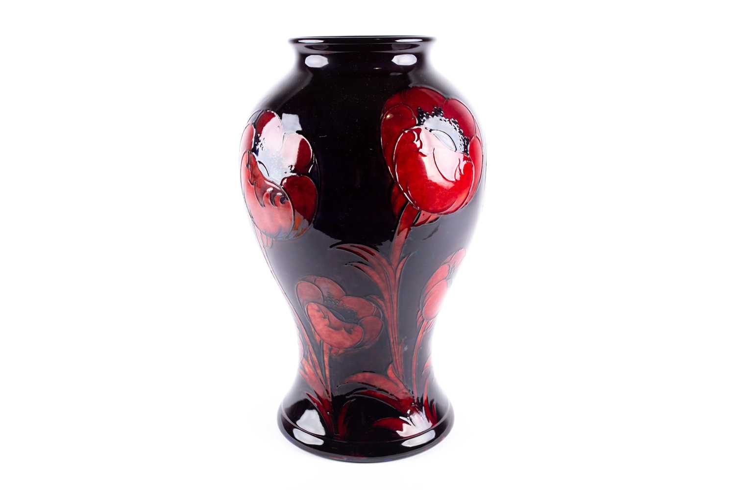 A William Moorcroft flambé 'Big Poppy' pattern vase, circa 1930, of baluster form, the poppies