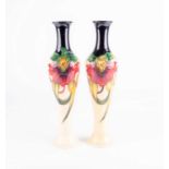 A pair of Moorcroft 'Anna Lily' pattern vases, designed by Nicola Slaney, date cypher 2010 & 2011,