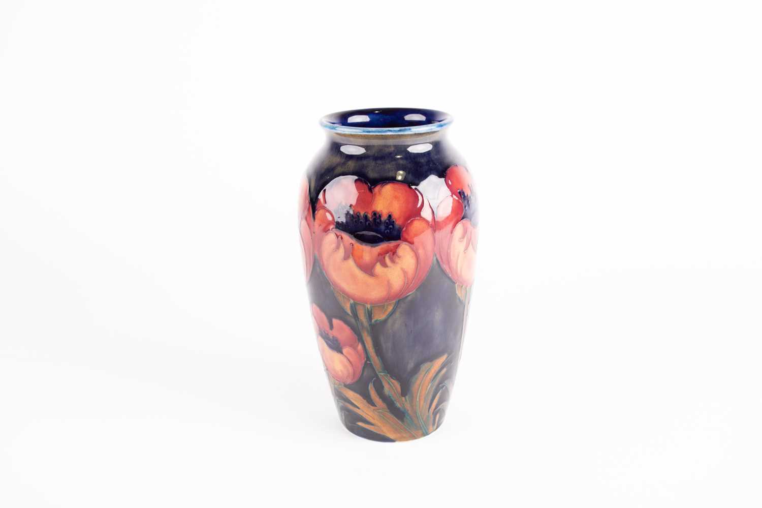 A Moorcroft Poppy pattern vase, early to mid 20th century, the poppies boldly decorated against a