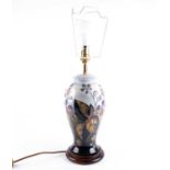 A Moorcroft 'Brambles' pattern table lamp, designed by Sally Tuffin, the well defined tube lined