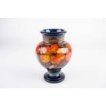 A William Moorcroft flambe African Lily pattern vase, second quarter 20th century, of baluster