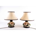 A pair of Moorcroft 'Magnolia' pattern table lamps, late 20th century, of compressed form, the