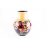 A large William Moorcroft Orchid pattern vase, second quarter 20th century, having a slightly
