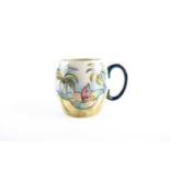 A Moorcroft 'Caribbean' pattern tankard, mid 20th century, decorated with boats and palm trees,