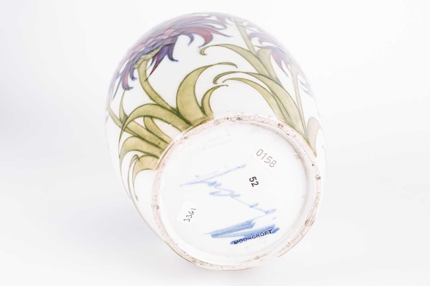 A William Moorcroft 'Cornflower' pattern vase, circa 1930, decorated on a white ground, inscribed - Image 4 of 6