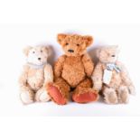 Three large collectable plush and jointed growling bears comprising, a golden plush Tuggley bear,