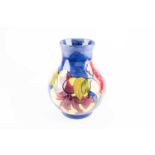 A Moorcroft Hibiscus pattern vase, third quarter of the 20th century, of bulbous form, the bold