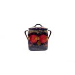 A William Moorcroft 'Pomegranate' pattern biscuit box and cover, circa 1920s, of square form with
