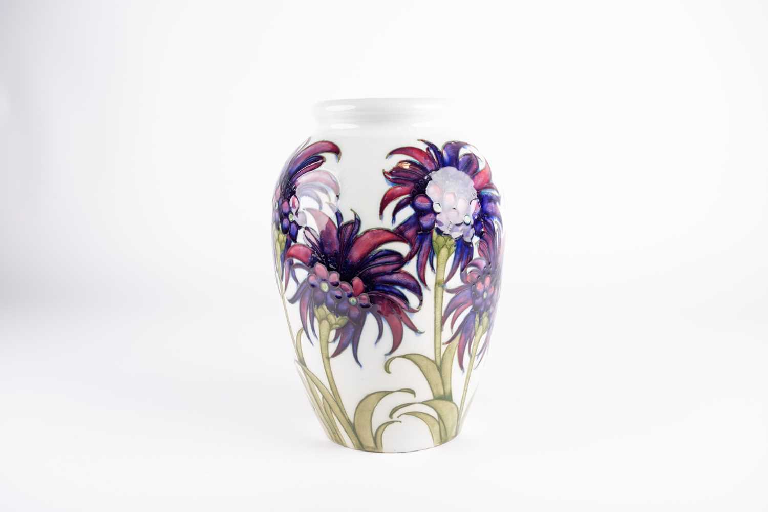 A William Moorcroft 'Cornflower' pattern vase, circa 1930, decorated on a white ground, inscribed - Image 2 of 6