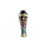 A Moorcroft Flower & Berry pattern vase designed by Nicola Slaney, date cypher 2009, of slender
